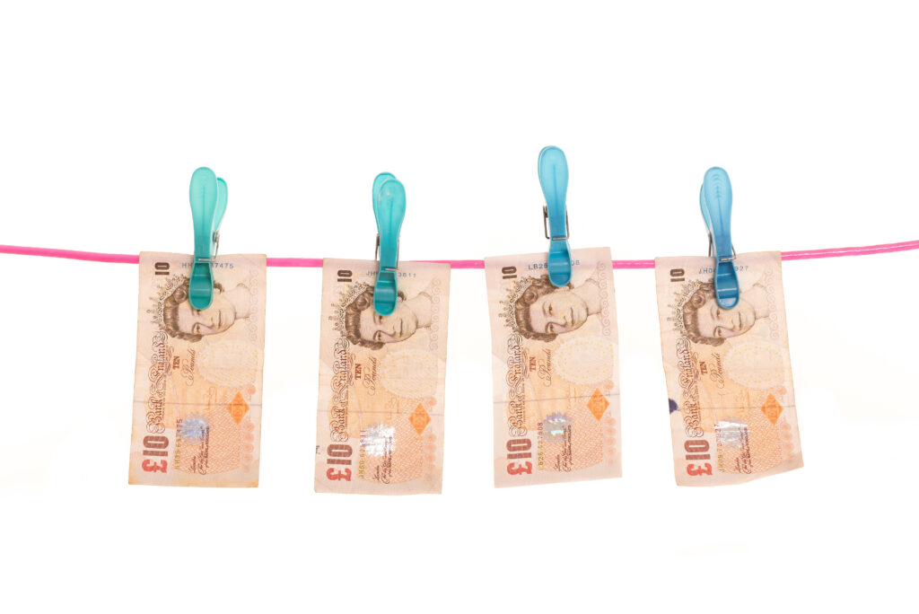 Wet bank notes hung to dry on laundry line